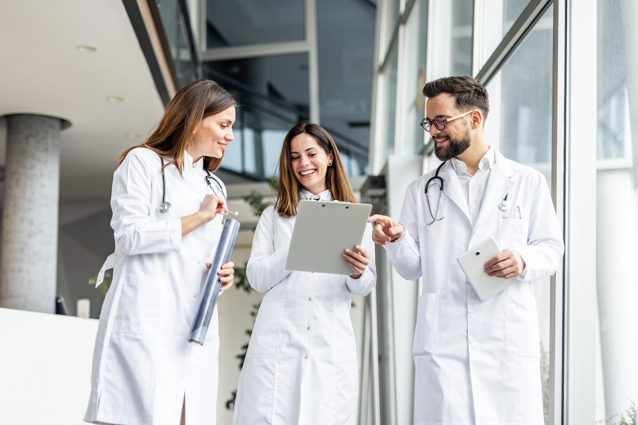 Doctors discussing patient notes in hospital
