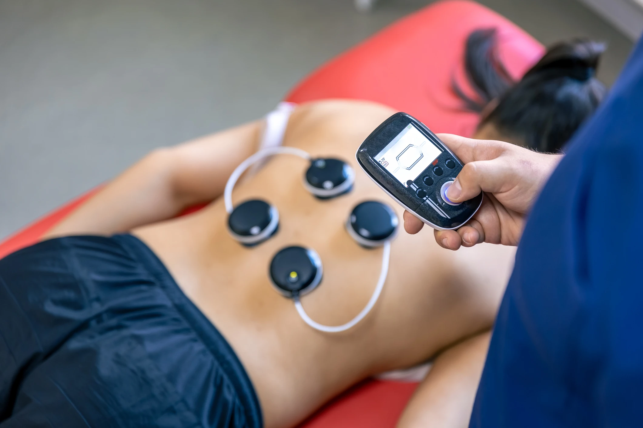 Physical therapy with electronic muscle stimulator.