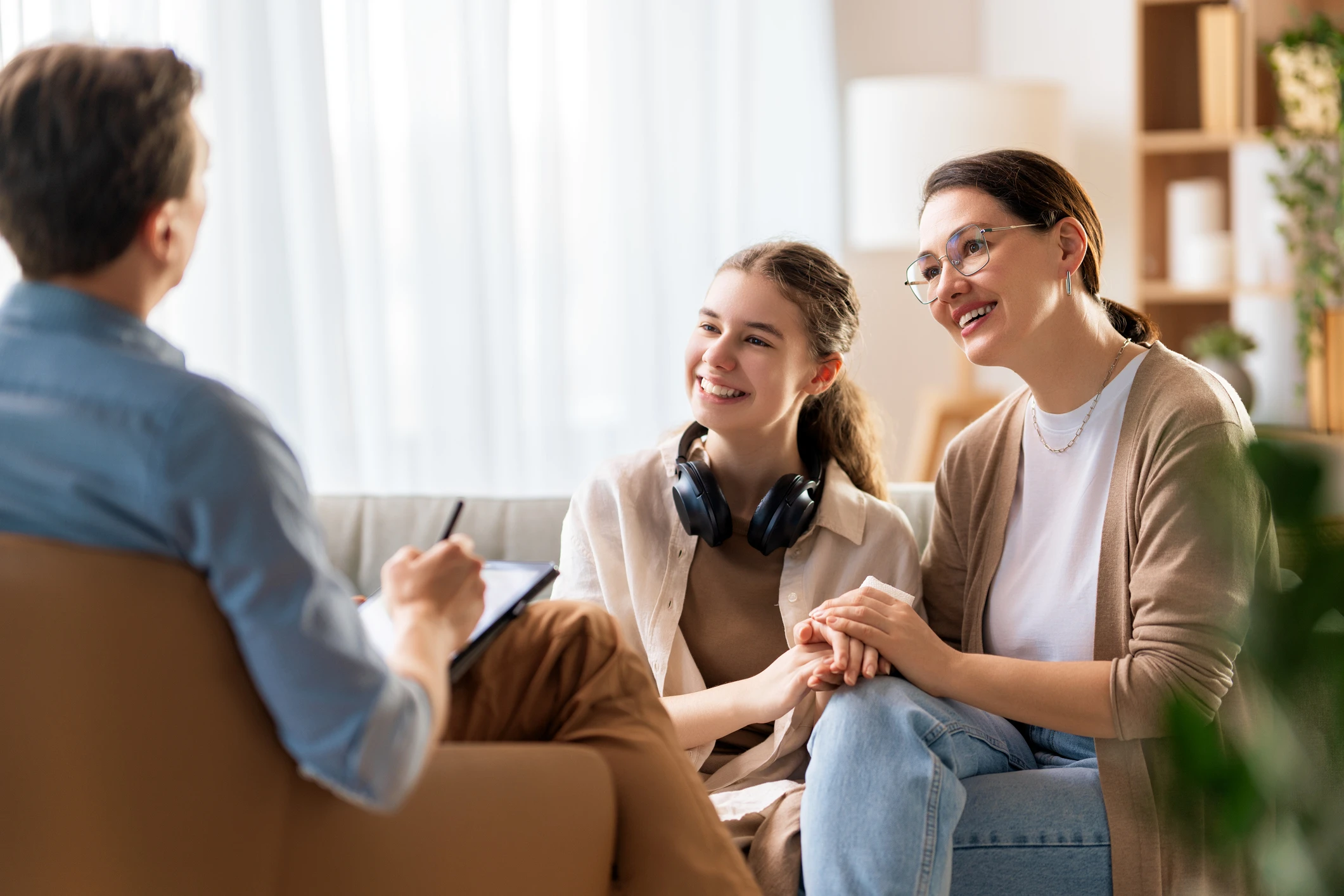 Therapist meeting with mother and daughter.