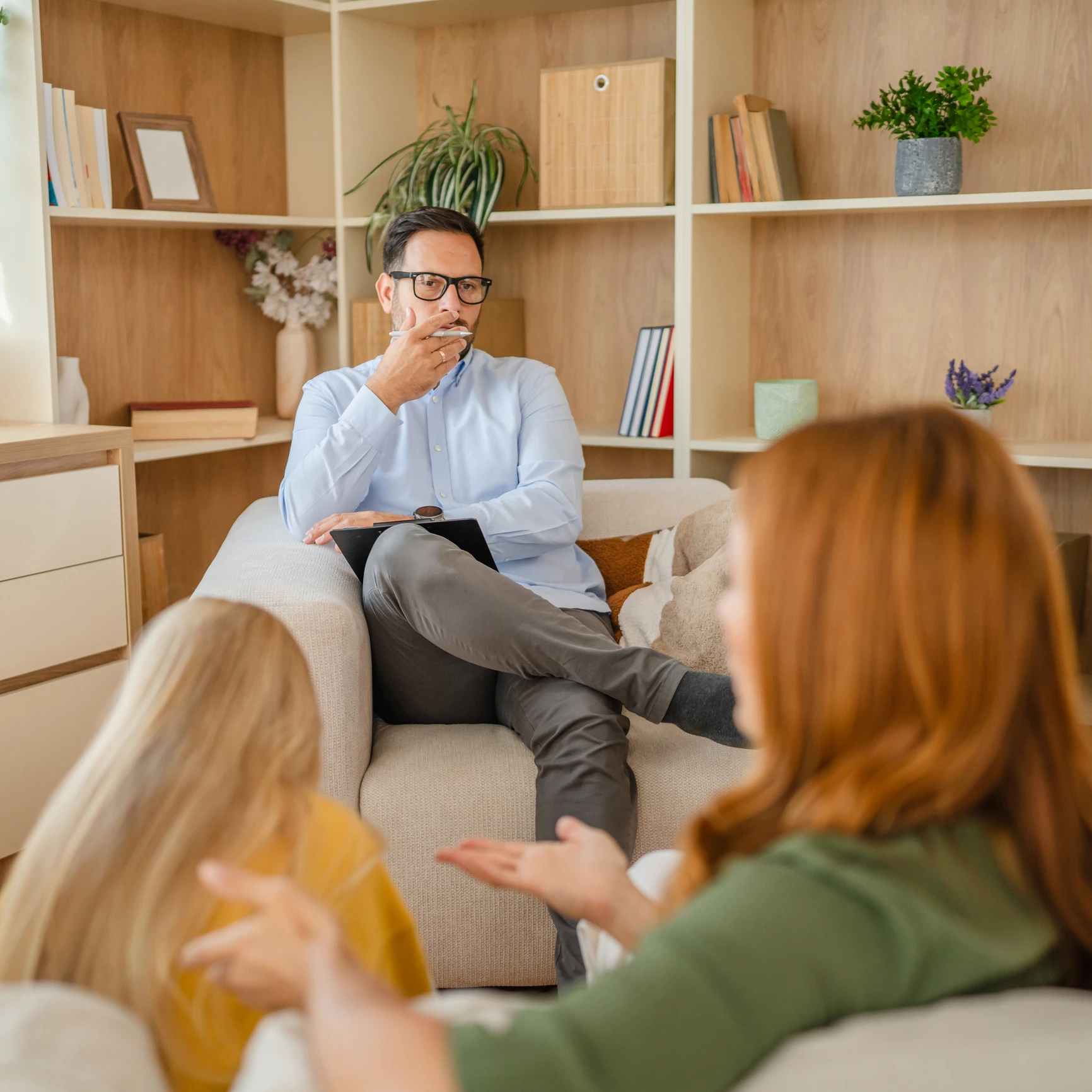 Family therapy session in a cozy room.