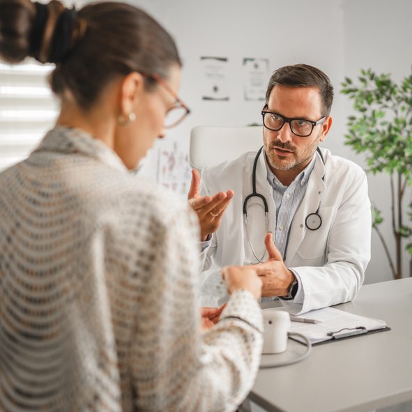 Doctor consulting with a female patient.