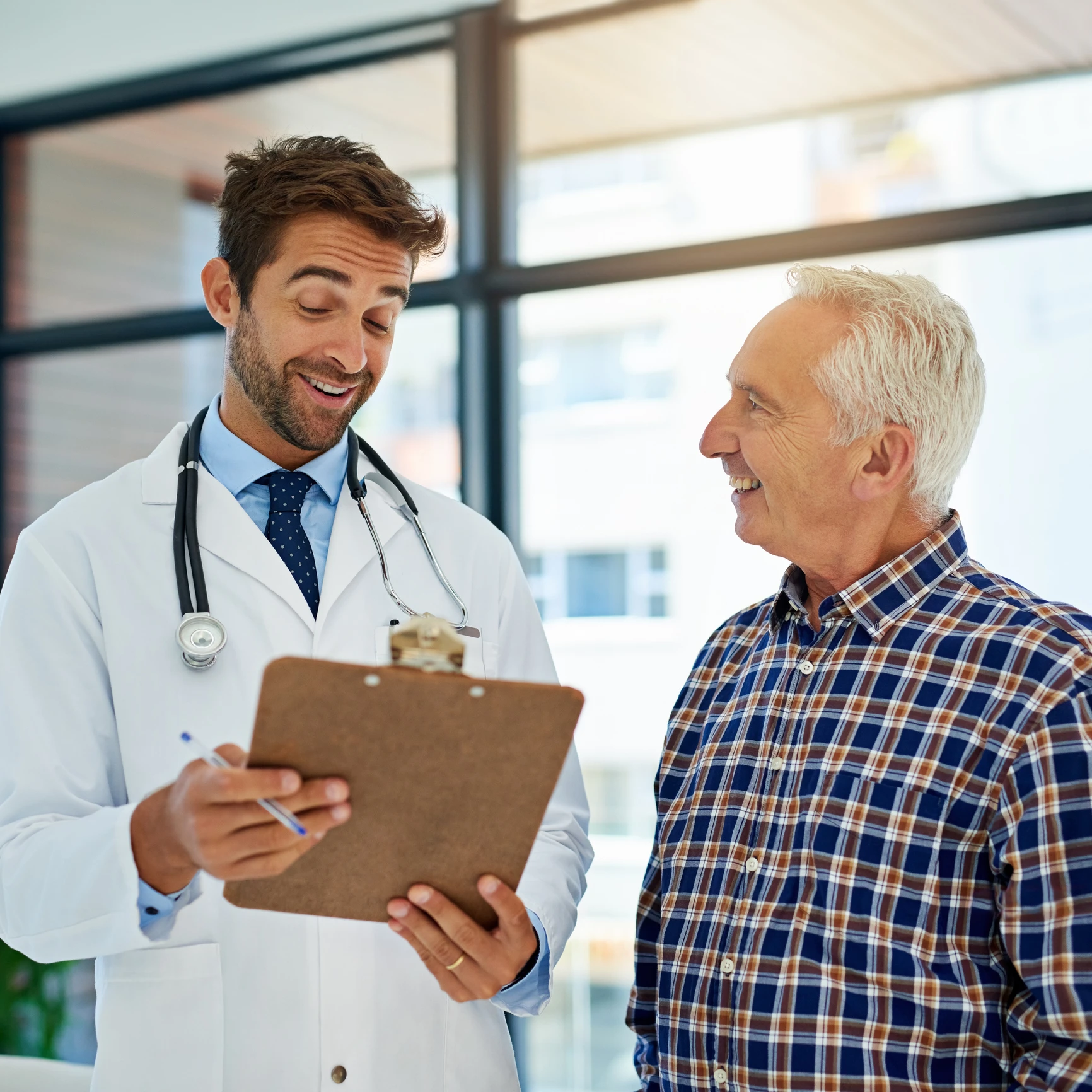 Doctor discussing results with smiling patient.