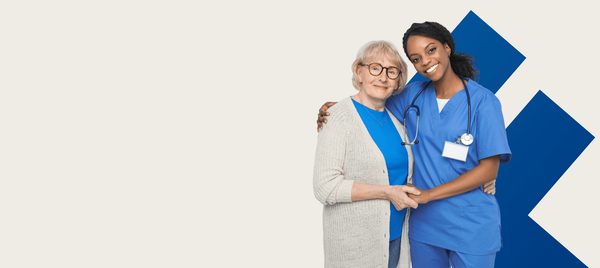 Nurse and elderly woman smiling together.