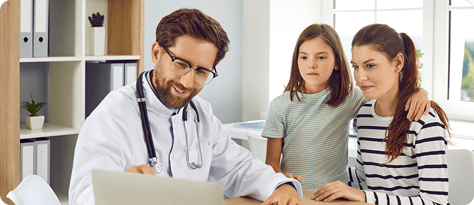 Doctor consulting with mother and daughter.